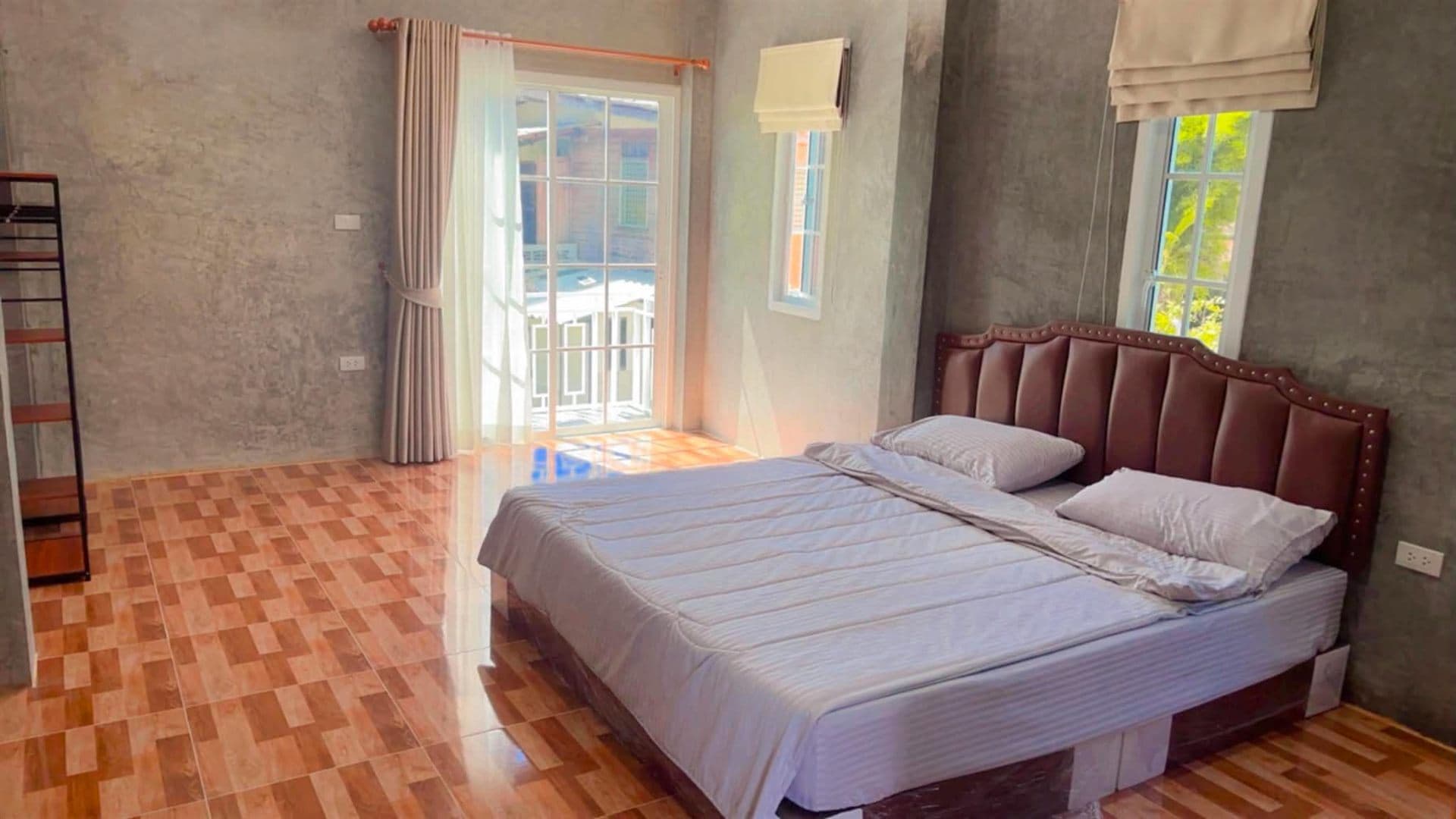 Bedroom with double bed and balcony access
